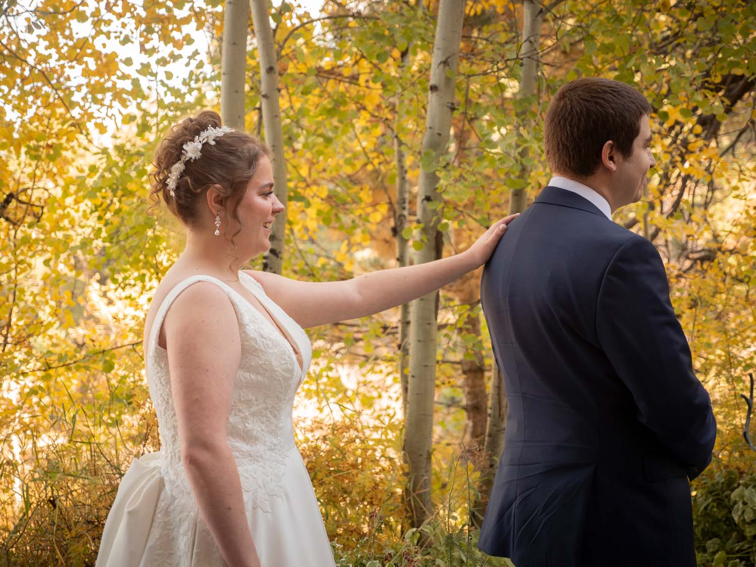 first look with bride and groom in the fall