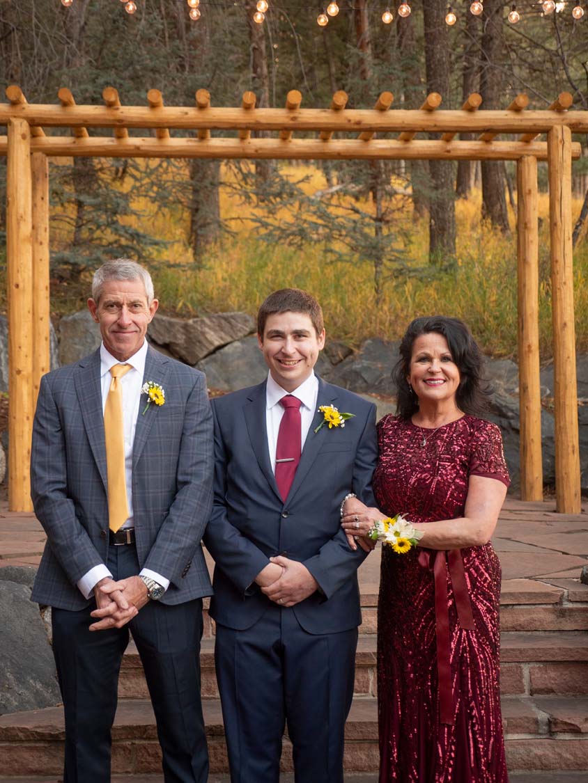 groom and his parents portrait at the pines genesee